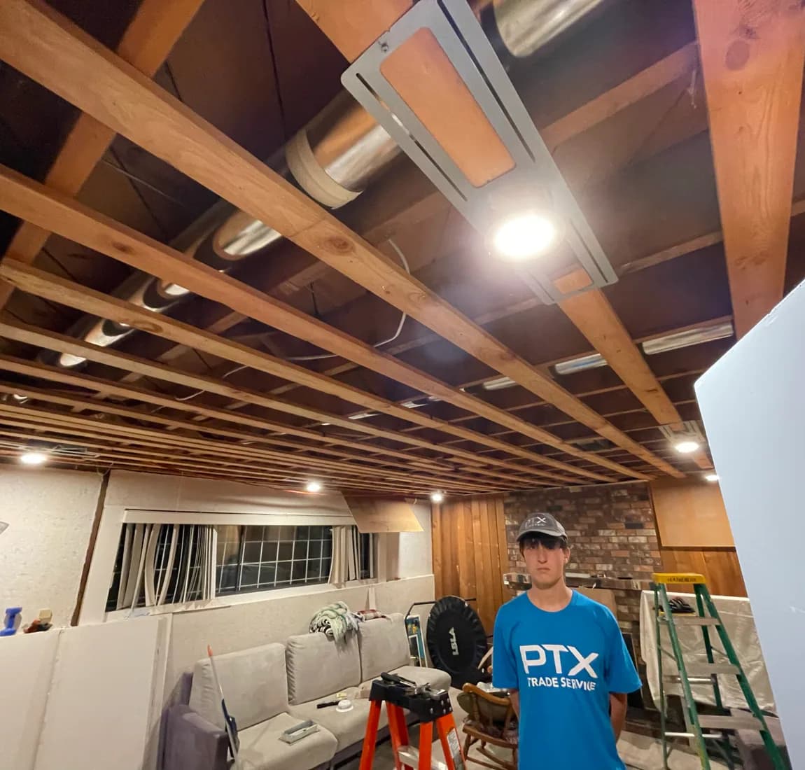 PTX team member completing lighting work during a residential turnaround