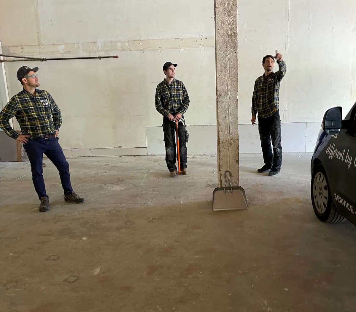PTX Electric team reviewing work at a project site