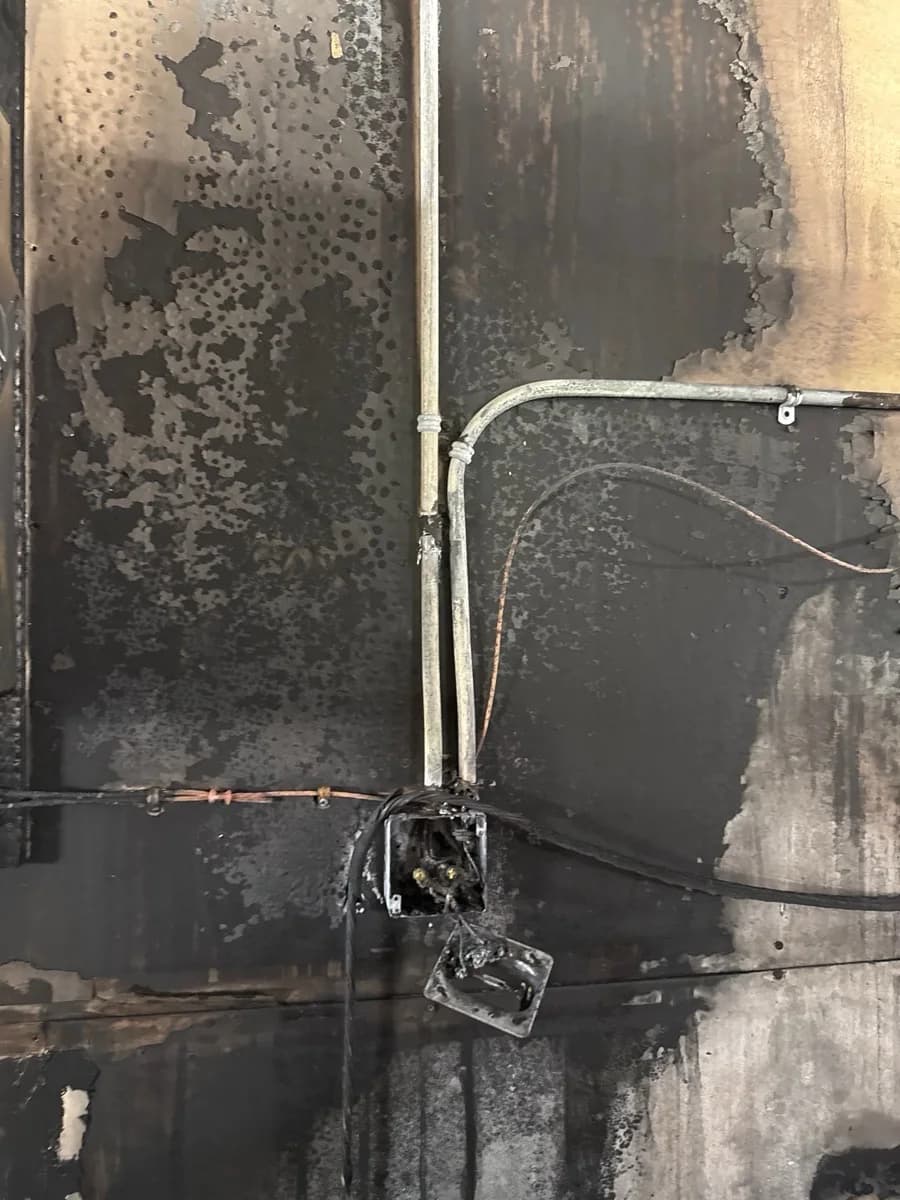 Fire-damaged electrical devices and wiring before rebuilding